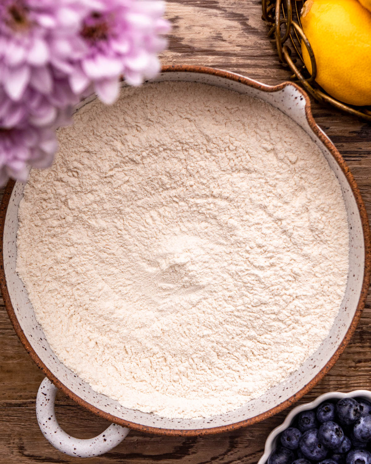 all purpose flour, baking powder, baking soda and salt whisked together in a pottery bowl