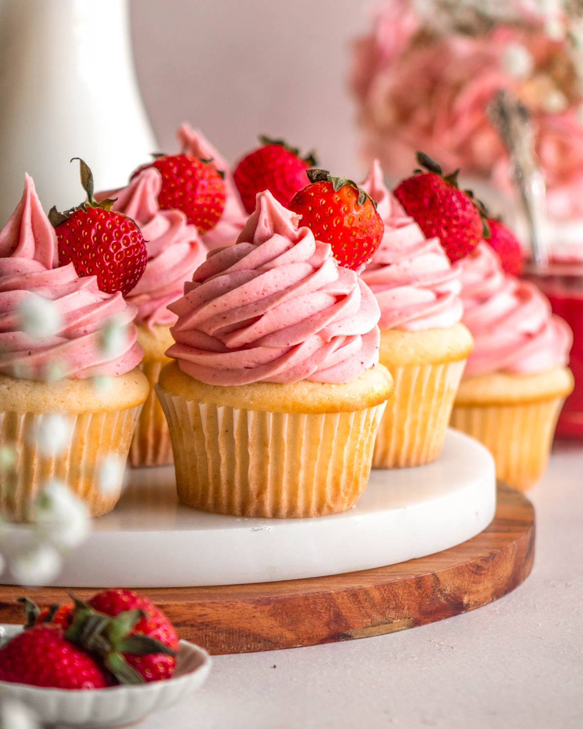 strawberry cupcakes on a marble tray