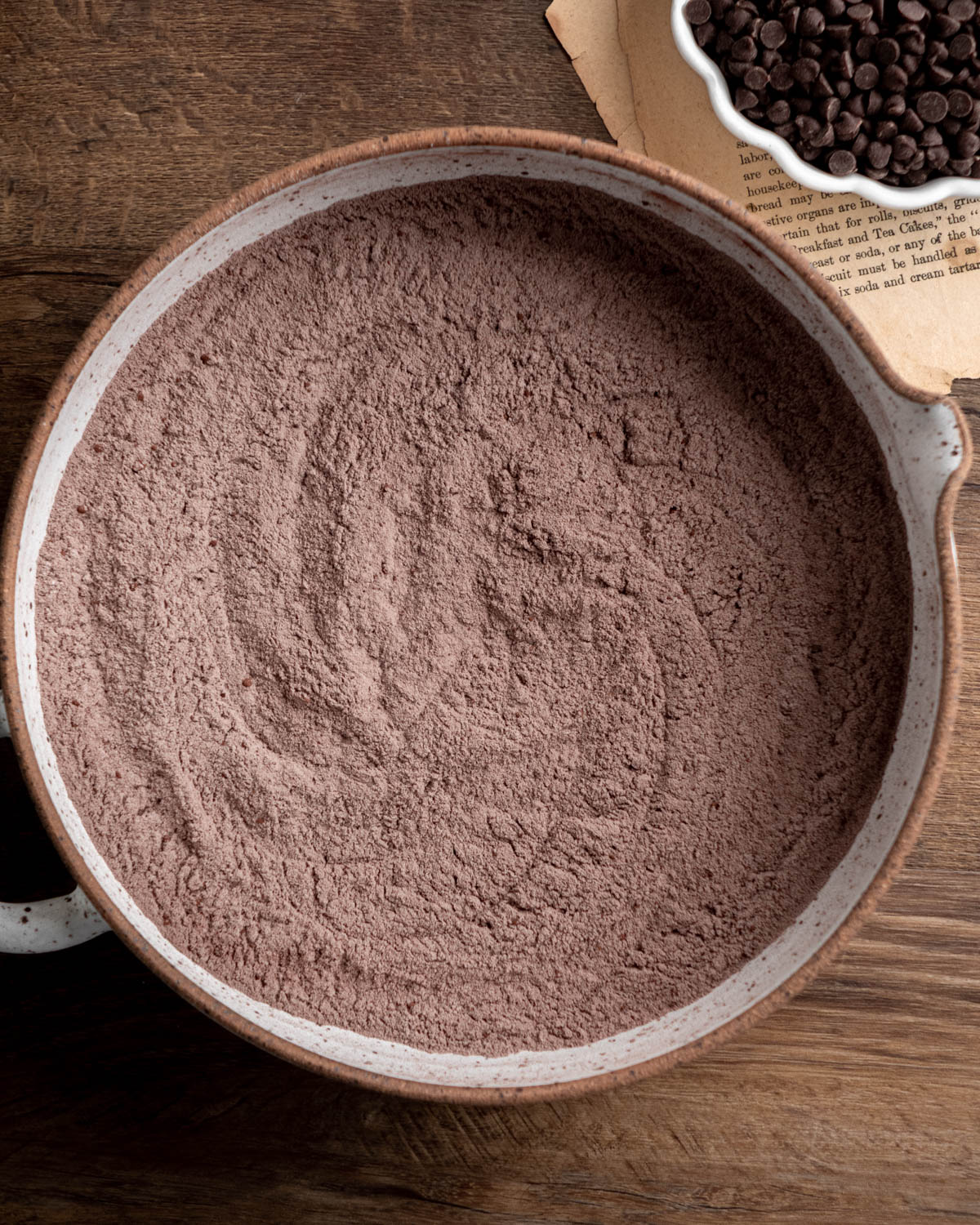 Flour, cocoa powder, baking soda, baking powder and salt whisked together in a pottery bowl