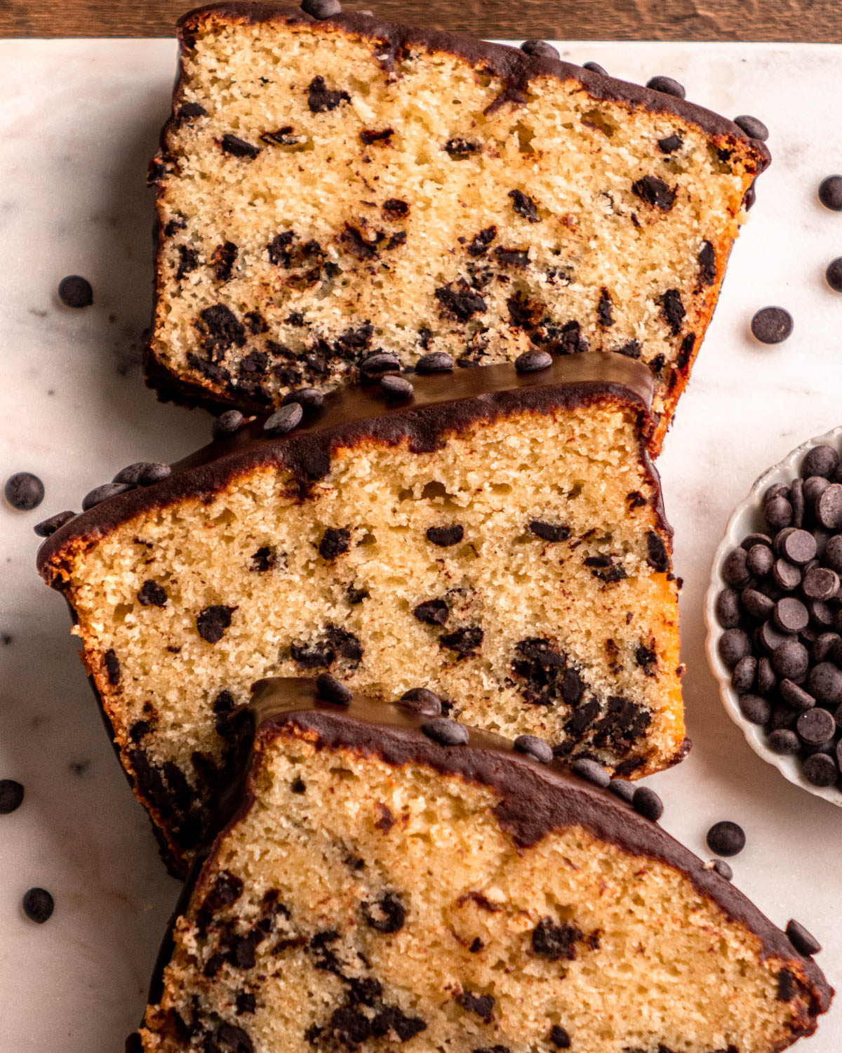 close up of three slices of chocolate chip loaf cake