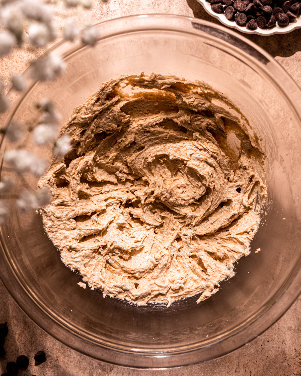 brown butter, brown sugar and white sugar creamed together in a glass bowl