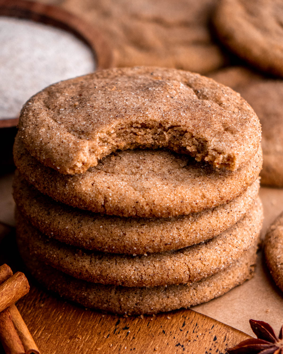 stack of chai cookies, top cookie with a bite taken out