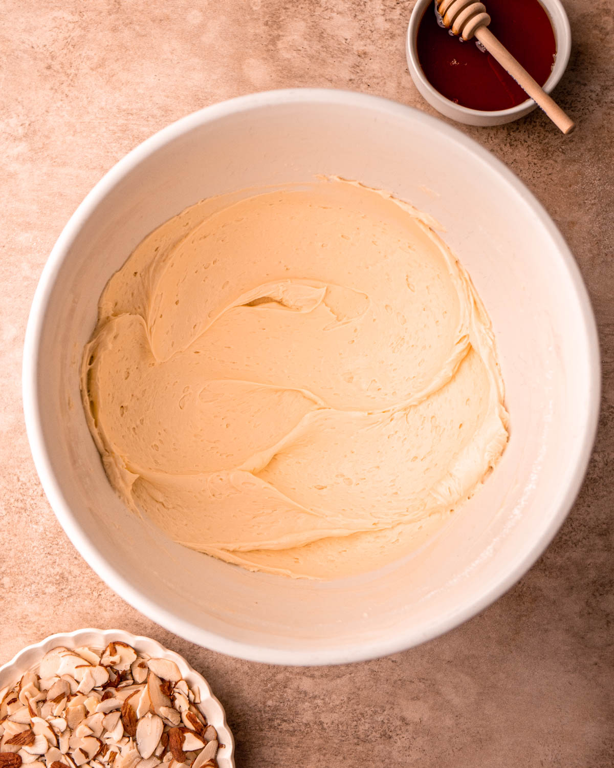 honey almond buttercream in a large bowl