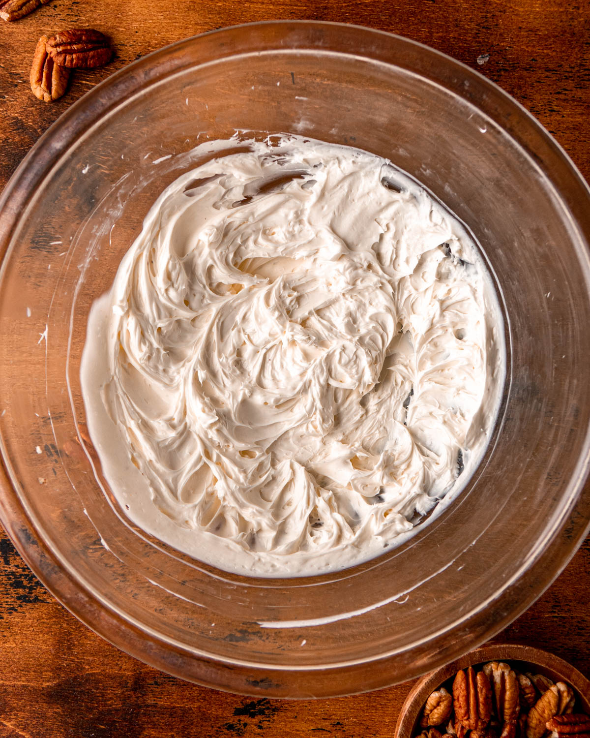 cream cheese whipped until smooth in a glass bowl