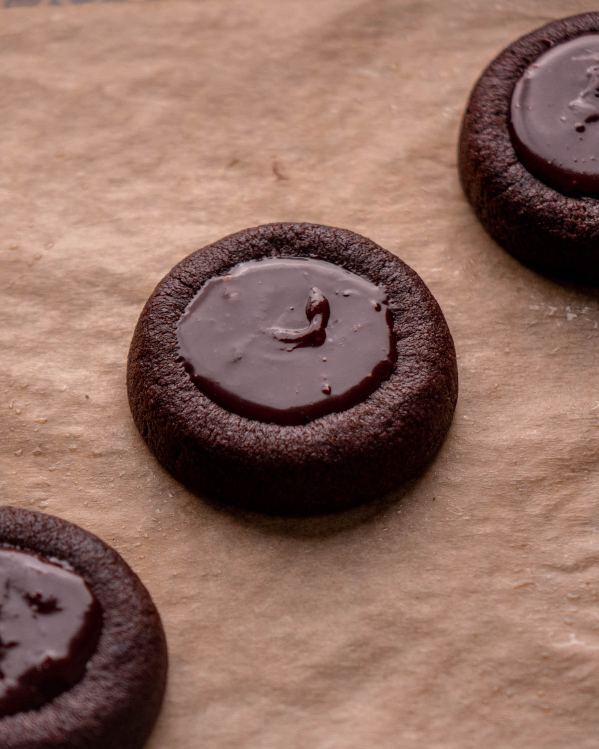 chocolate thumbprint cookies filled with chocolate cherry ganache