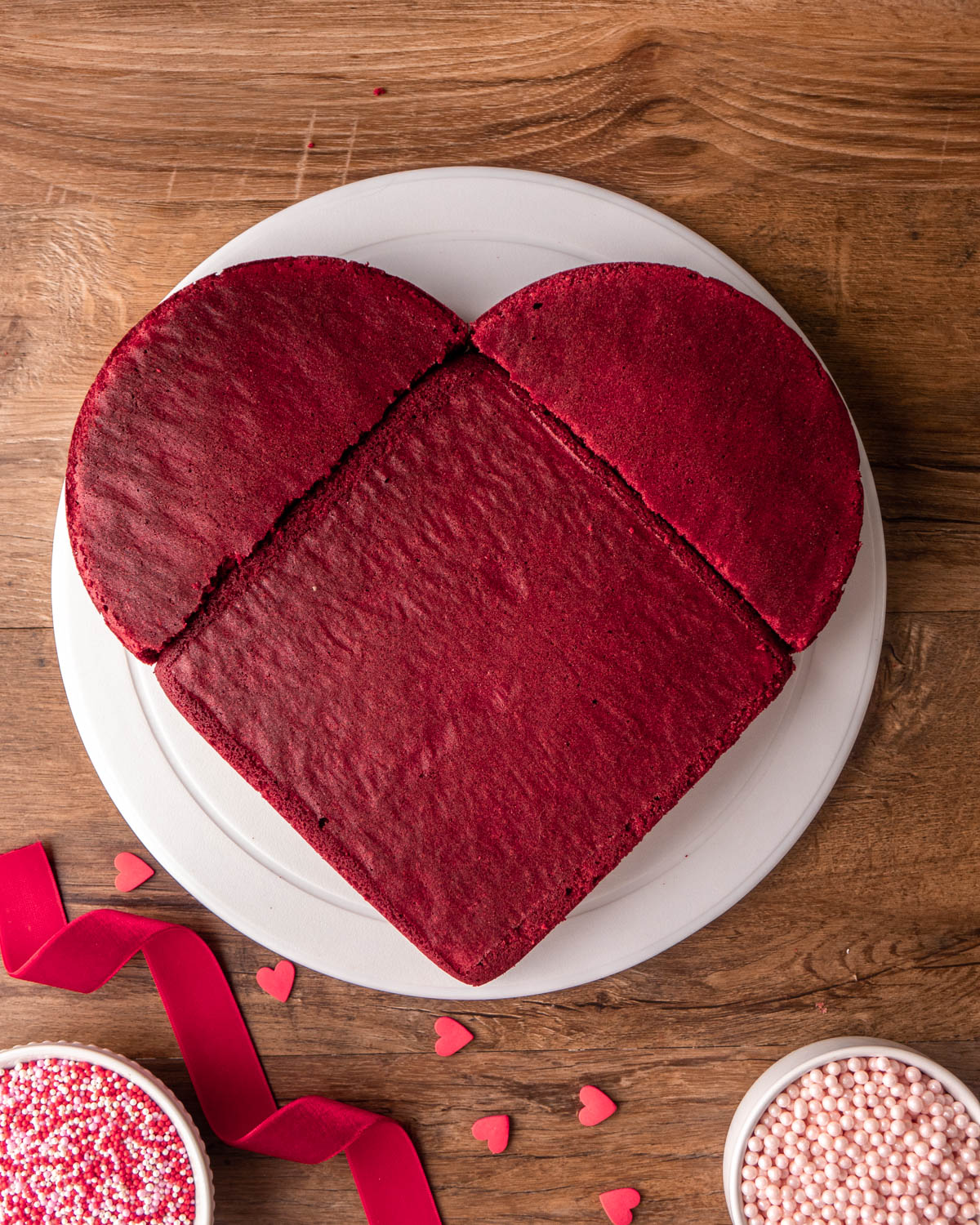 round cake cut in half and placed around square cake to form a heart