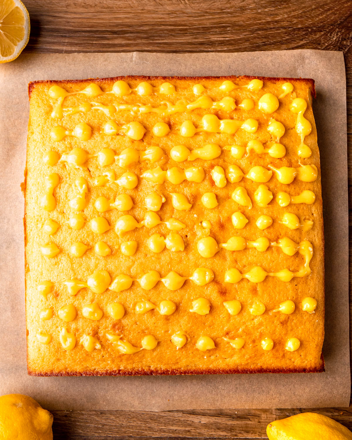 cake poked with holes and filled with lemon curd