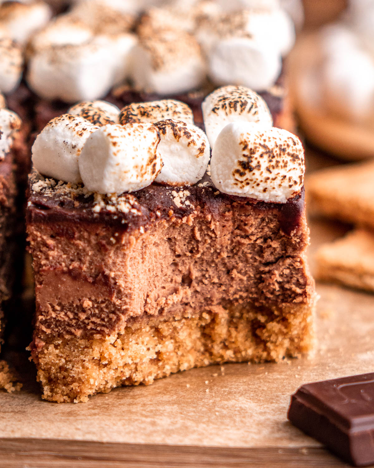 s'mores cheesecake bar with a bite taken out