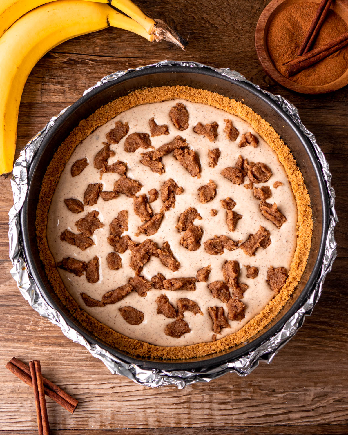 ⅓ of cheesecake batter poured into pan with ⅓ of cinnamon sugar filling sprinkled over top